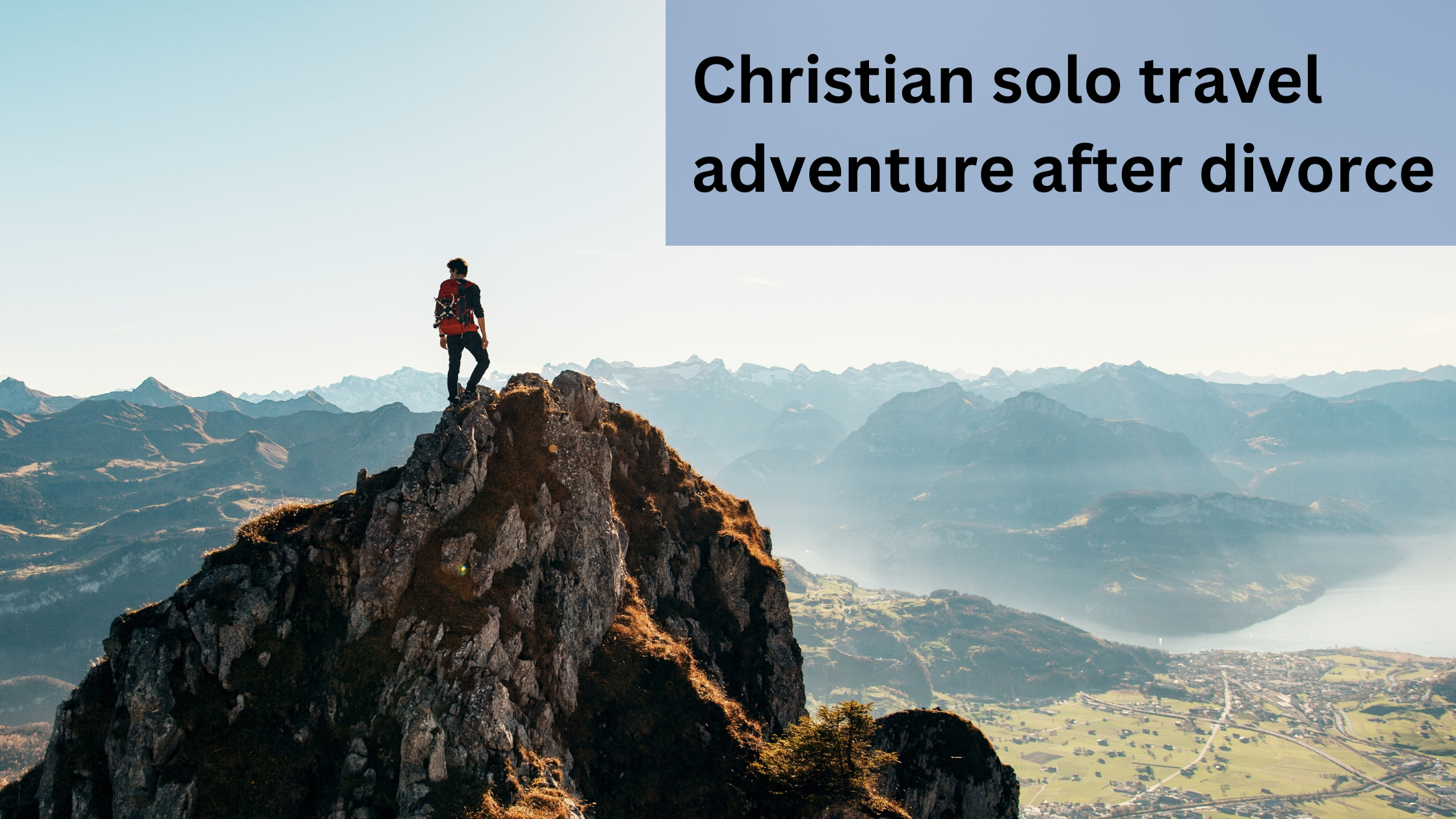 A solo traveler looking out across a mountain landscape